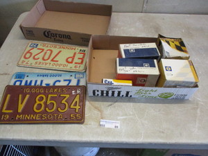 lot 89 image: License plates and auto parts