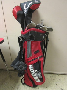 lot 935 image: WILSON HIGH MOI GOLF CLUBS, INCLUDING A TITANIUM COMPOSITE DRIVER, WITH BAG