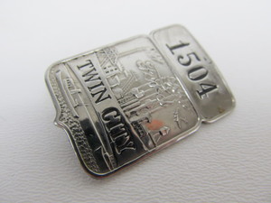lot 180 image: Old Vintage Deco FORD Twin City Badge & Book