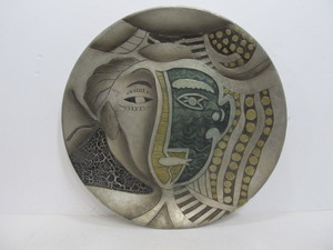 lot 243 image: Large Picasso Style Relief Face Pottery Charger Platter