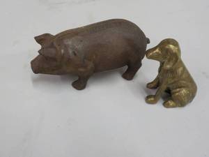 lot 82 image: Cast Iron Pig and Brass Dog pig is...
