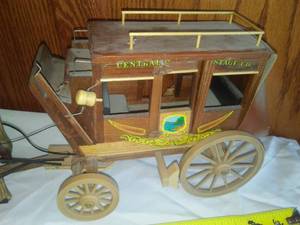 lot 52 image: Wood stagecoach & 4 wood horses.