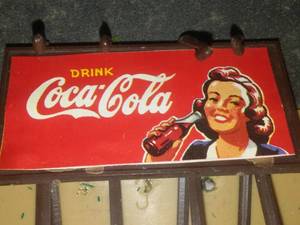 lot 244 image: 2 buildings Store & lumberyard. Coca Cola Sign.