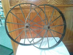 lot 122 image: 2 Cast wheels - metal, 23.5 diameter.