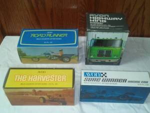 lot 253 image: Avon new in box - semi, trike, tractor, race care.