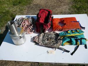 lot 169 image: 2 life jackets back pack, misc. ropes, fabric tote, camping cooking kit, oster cooler and tote