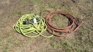 lot 215 image: Garden Hose and Sprinkler