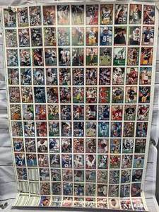 lot 15 image: Uncut Sheet 1991 Topps Football Cards