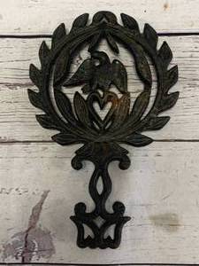 lot 38 image: Griswold Cast Iron Eagle Trivet No. 1730