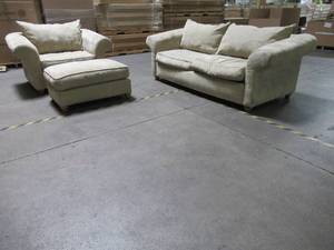lot 99 image: SOFA AND LARGE ARM CHAIR WITH OTTOMAN IN BEIGE - USED.