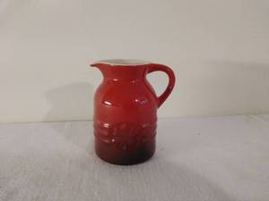 lot 177 image: Le Creuset 6oz Stoneware Syrup Pitcher