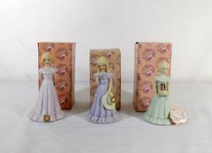 lot 255 image: Vintage 1981 Growing Up Birthday Girl Lot of 3 Statues