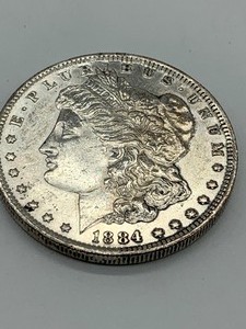 lot 240 image: 1884- D  Morgan Peace Dollar