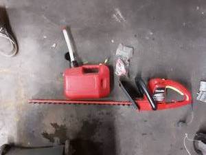 lot 104 image: Homelite Electric Hedger & 1-Gallon Gas Can