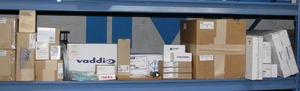 lot 104 image: HUGE 8 Shelf Lot of Miscellaneous New Open Box & Demo Pro Audio  Video Audiovisual Items & Equipment