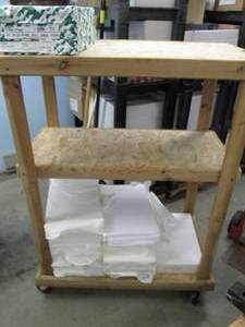 lot 112 image: Wood Shelf of Wheels Full of 11 X ...