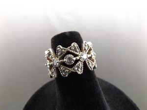 lot 74 image: .925 Sterling Silver Crystal Flower Full Band Ring Size 5