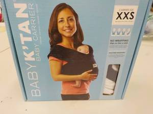 lot 57 image: Baby K tan Baby Carrier...