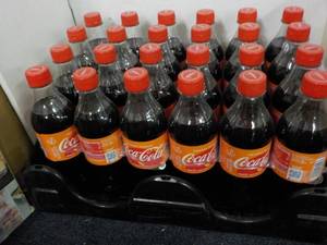 lot 85 image: Case of 24 - 16.9 oz Bottles Coca C...