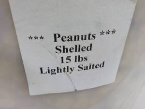lot 100 image: 15 lb. Pail of Lighted Salted Peanu...