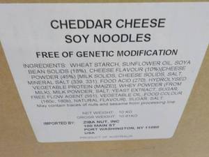 lot 120 image: 23 lb. Box of Cheddar Cheese Soy Ne...