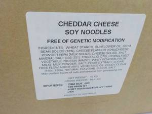 lot 122 image: 23 lb. Box of Cheddar Cheese Soy Ne...