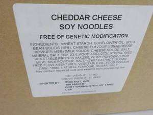 lot 123 image: 23 lb. Box of Cheddar Cheese Soy Ne...