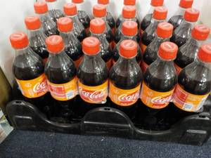 lot 140 image: Case of 24 - 16.9 oz Bottles Coca C...