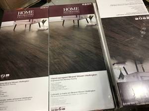 lot 41 image: 7 CASES OF HOME DECORATORS COLLECTION Hand Scraped Strand Woven Wellington 38 in. T x 5-18 in. W x 36 in. L Engineered Click Bamboo Flooring