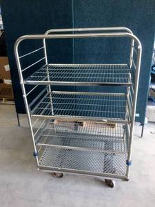 lot 29 image: Getinge Floor Loading 4003 4 Shelf Sterilizer Stainless Steel Cart is an all-purpose cartdesigned for processing, transportation and storage. The cartis constructed to resist the corrosive action of high temperature steam sterilization.