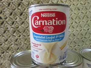 lot 172 image: 11 Cans of Evaporated Lowfat 2% Mil...