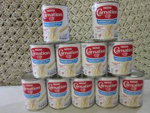 lot 173 image: 11 Cans of Evaporated Lowfat 2% Mil...