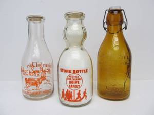 lot 76 image: Lot of 3 Vintage Advertising DairyMilk Bottles