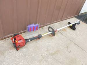 lot 5 image: Craftsman 4 cycle weed trimmer. Lightly used. Tested & works. As shown.