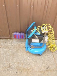 lot 11 image: Power Glyde 4 Gallon pancake air compressor with hose. Fast recovery. Tested & works. As shown.