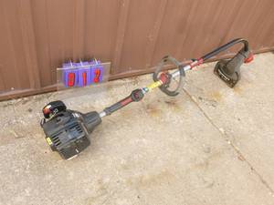 lot 12 image: Craftsman 2 cycle weed trimmer. Lightly used. Tested & works. As shown.