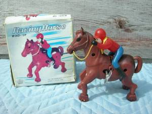 lot 15 image: Kron Wind-up Racing Horse