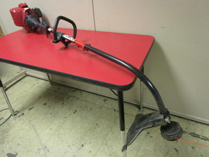 lot 723 image: TROY-BILT 2-CYCLE STRING TRIMMER