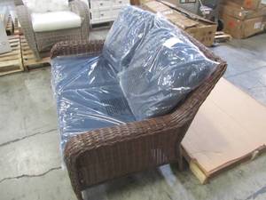 lot 217 image: Hampton Bay Cambridge Brown Wicker Outdoor Loveseat with Blue Cushions 65-17148B3