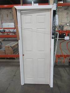 lot 622 image: ProCore 30 x 78 (approximate) 6 Panel, Solid Core Door Slab. - Some scratches, broken jamb.
