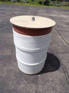 lot 77 image: Plastic Barrel with Lid and Rose insulators