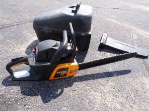lot 86 image: Pouland Chain Saw with case