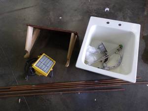 lot 111 image: Small sink with Faucet, copper Pipe, Work Light and Bike rack