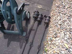 lot 173 image: 3 Tiki Torches with oil and Garden Hose Reel