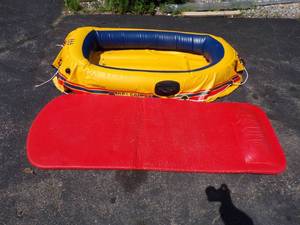 lot 302 image: REI Camper Inflatable Boat and water cushion