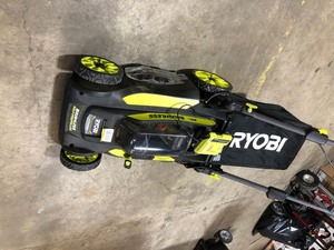 lot 47 image: RYOBI 20 in. 40-Volt Brushless Lithium-Ion Cordless Battery Self Propelled Lawn Mower with Battery and Charger Included Im working condition see pics 