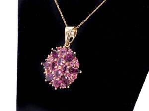 lot 28 image: Ladies Pink Sapphire and Garnet Estate Pendant in 14k Yellow Gold $2650