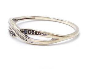 lot 83 image: Black and White Diamond Criss Cross Estate Ring