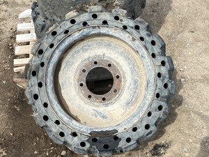 lot 14 image: (4) Never-Flat Skid-Loader Wheels & Tires