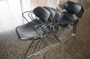 lot 56 image: 10 Black Plastic Chairs